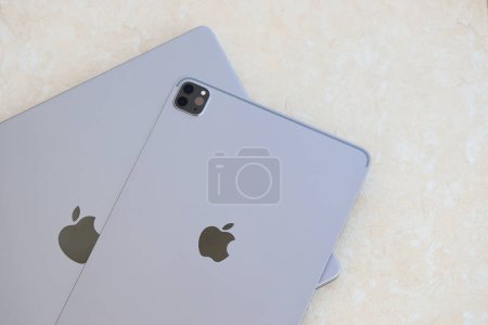 Photo for KYIV, UKRAINE - 4 MAY, 2023: Apple brand device ipad lies on macbook body close up - Royalty Free Image