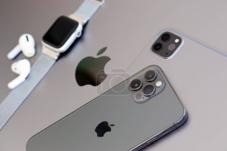 Photo for KYIV, UKRAINE - 4 MAY, 2023: Apple brand devices iphone, ipad and airpods with apple watch lies on macbook body close up - Royalty Free Image