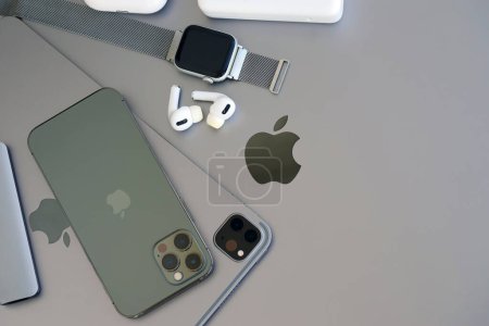 Photo for KYIV, UKRAINE - 4 MAY, 2023: Apple brand devices iphone, ipad and airpods with apple watch lies on macbook body close up - Royalty Free Image