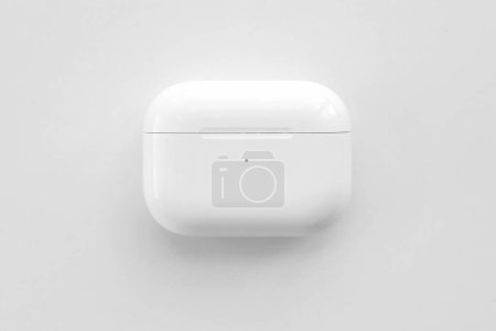 Photo for KYIV, UKRAINE - 4 MAY, 2023: Apple AirPods Pro on a white background. Wireless headphones in a charging case close-up - Royalty Free Image