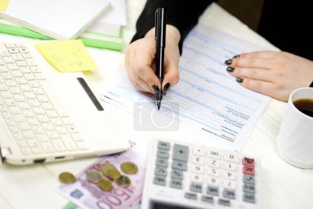 Accountant fill italian tax form F24 Unified payment model in end of tax period. Taxation and paperwork routine in Italy