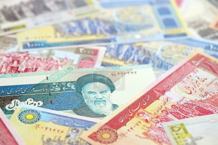 Photo for Big pile of Iranian Rial IRR banknotes from Iran as the background on flat surface close up - Royalty Free Image