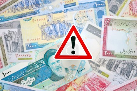 Photo for Small exclamation sign lies on pile of iranian money close up. Sanctions, ban or embargo concept - Royalty Free Image