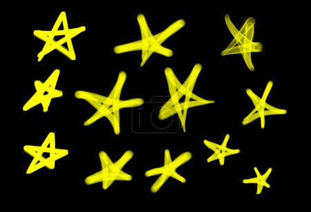 Foto de Colección de etiquetas de graffiti street art con símbolos estrella en color amarillo sobre fondo negro - Imagen libre de derechos