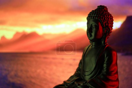 Photo for Buddha Purnima and Vesak day concept, Buddha statue with low key light against beautiful and colorful background close up. Meditation - Royalty Free Image