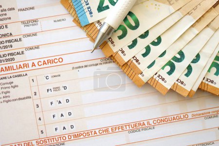 Photo for Filling italian tax form process with pen and euro money bills close up. Tax paying period and deadline - Royalty Free Image