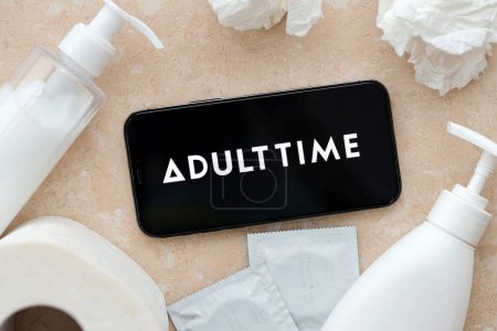 Photo for KYIV, UKRAINE - JANUARY 23, 2024 AdultTime adult content website logo on display of iPhone 12 Pro smartphone - Royalty Free Image