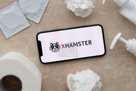 Photo for KYIV, UKRAINE - JANUARY 23, 2024 XHamster adult content website logo on display of iPhone 12 Pro smartphone - Royalty Free Image