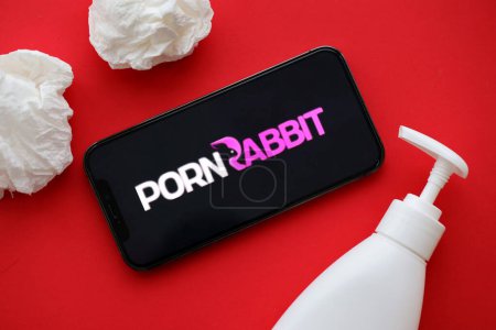 Photo for KYIV, UKRAINE - JANUARY 23, 2024 PornRabbit adult content website logo on display of iPhone 12 Pro smartphone - Royalty Free Image