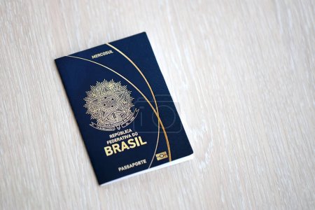 Passport book of Federative Republic of Brazil on wooden background close up