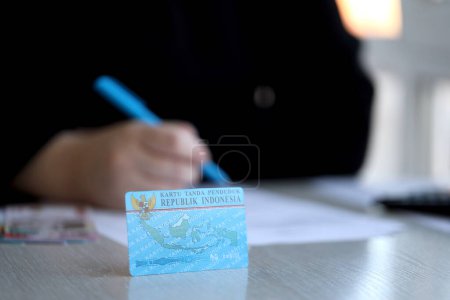 Photo for Indonesian national electric identity card called E-KTP or Kartu Tanda Penduduk. Card for citizens or permanent residents - Royalty Free Image