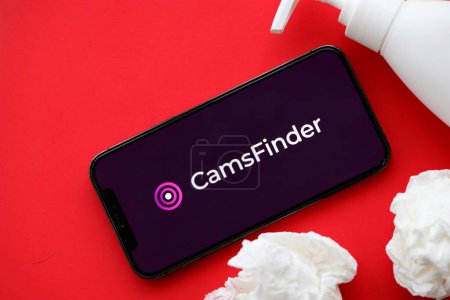 Photo for KYIV, UKRAINE - JANUARY 23, 2024 CamsFinder adult content website logo on display of iPhone 12 Pro smartphone - Royalty Free Image