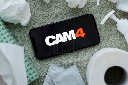Photo for KYIV, UKRAINE - JANUARY 23, 2024 Cam4 adult content website logo on display of iPhone 12 Pro smartphone - Royalty Free Image