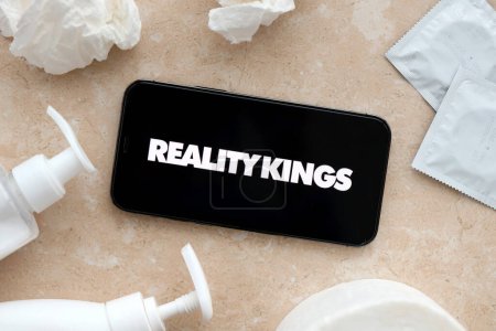Photo for KYIV, UKRAINE - JANUARY 23, 2024 RealityKings adult content website logo on display of iPhone 12 Pro smartphone - Royalty Free Image