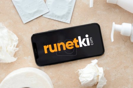 Photo for KYIV, UKRAINE - JANUARY 23, 2024 Runetki adult content website logo on display of iPhone 12 Pro smartphone - Royalty Free Image