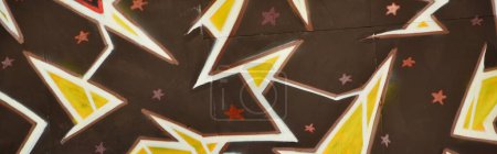 Photo for Colorful background of graffiti painting artwork with bright aerosol outlines on wall. Old school street art piece made with aerosol spray paint cans. Contemporary youth culture backdrop - Royalty Free Image