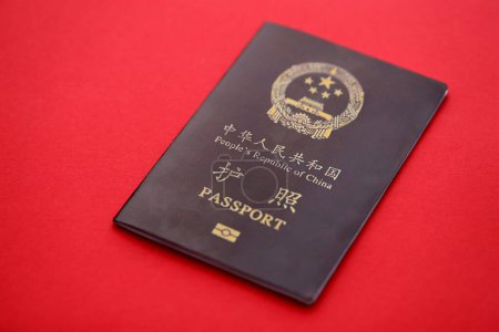 Red passport of People Republic of China. PRC chinese passport on bright background close up