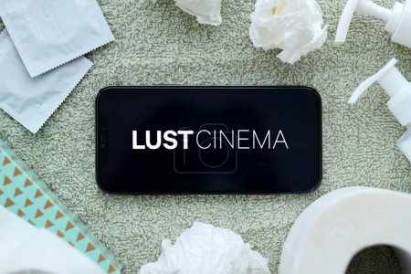 Photo for KYIV, UKRAINE - JANUARY 23, 2024 LustCinema adult content website logo on display of iPhone 12 Pro smartphone - Royalty Free Image