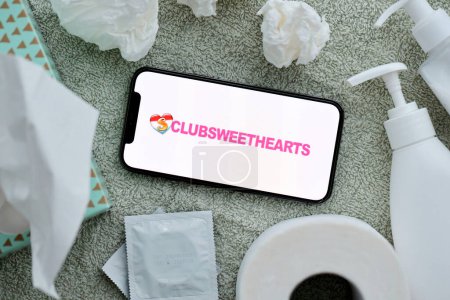 Photo for KYIV, UKRAINE - JANUARY 23, 2024 ClubSweetHearts adult content website logo on display of iPhone 12 Pro smartphone - Royalty Free Image