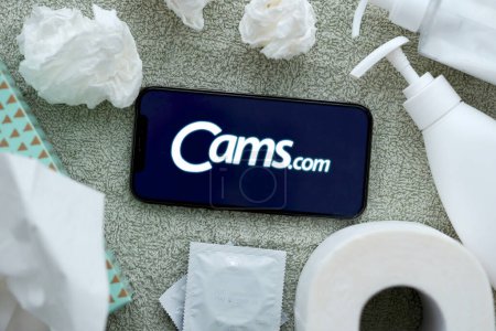 Photo for KYIV, UKRAINE - JANUARY 23, 2024 CamsCom adult content website logo on display of iPhone 12 Pro smartphone - Royalty Free Image