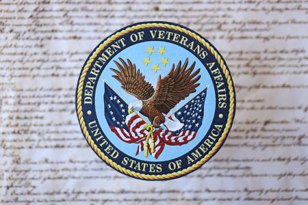 Photo for KYIV, UKRAINE - MARCH 9, 2024 US Department of Veteran Affairs seal on United States Constitution close up - Royalty Free Image