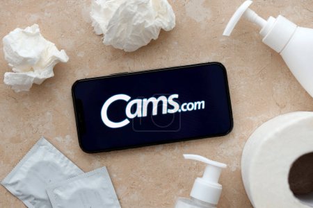 Photo for KYIV, UKRAINE - JANUARY 23, 2024 CamsCom adult content website logo on display of iPhone 12 Pro smartphone - Royalty Free Image