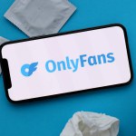 KYIV, UKRAINE - JANUARY 23, 2024 OnlyFans adult content website logo on display of iPhone 12 Pro smartphone