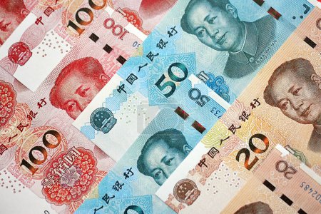 Many money bills of People Republic of China. PRC Yuan banknotes close up