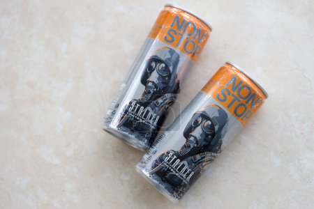 Photo for KYIV, UKRAINE - OCTOBER 31, 2023 Non Stop energy drink with limited edition design of Stalker and character with gas mask on aluminium tin can close up - Royalty Free Image