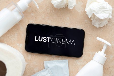 Photo for KYIV, UKRAINE - JANUARY 23, 2024 LustCinema adult content website logo on display of iPhone 12 Pro smartphone - Royalty Free Image