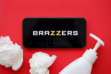 Photo for KYIV, UKRAINE - JANUARY 23, 2024 Brazzers adult content website logo on display of iPhone 12 Pro smartphone - Royalty Free Image