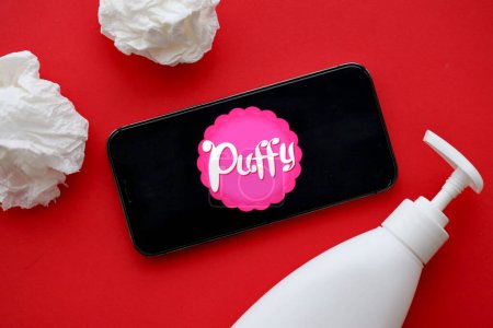Photo for KYIV, UKRAINE - JANUARY 23, 2024 PuffyNetwork adult content website logo on display of iPhone 12 Pro smartphone - Royalty Free Image