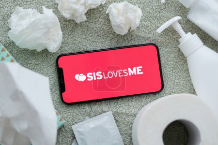 Photo for KYIV, UKRAINE - JANUARY 23, 2024 SisLovesMe adult content website logo on display of iPhone 12 Pro smartphone - Royalty Free Image