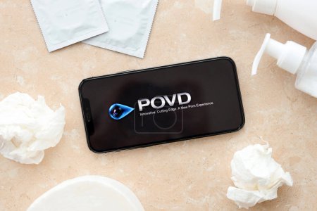 Photo for KYIV, UKRAINE - JANUARY 23, 2024 POVD adult content website logo on display of iPhone 12 Pro smartphone - Royalty Free Image