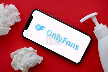 Photo for KYIV, UKRAINE - JANUARY 23, 2024 OnlyFans adult content website logo on display of iPhone 12 Pro smartphone - Royalty Free Image