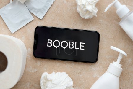 Photo for KYIV, UKRAINE - JANUARY 23, 2024 Booble adult content website logo on display of iPhone 12 Pro smartphone - Royalty Free Image