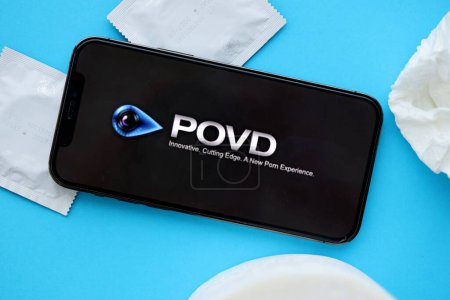 Photo for KYIV, UKRAINE - JANUARY 23, 2024 POVD adult content website logo on display of iPhone 12 Pro smartphone - Royalty Free Image