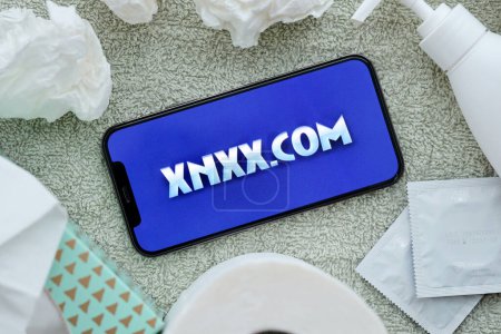 Photo for KYIV, UKRAINE - JANUARY 23, 2024 XNXX adult content website logo on display of iPhone 12 Pro smartphone - Royalty Free Image