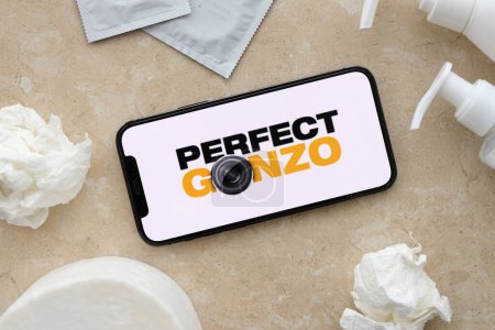 Photo for KYIV, UKRAINE - JANUARY 23, 2024 PerfectGonzo adult content website logo on display of iPhone 12 Pro smartphone - Royalty Free Image