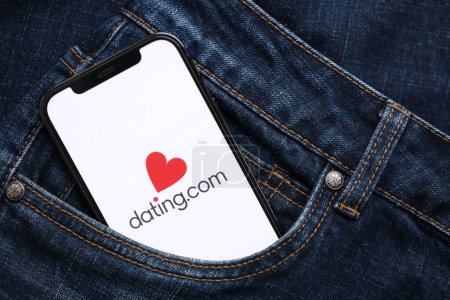 Photo for KYIV, UKRAINE - FEBRUARY 23, 2024 Datingcom logo of famous dating website or app on iPhone display screen close up - Royalty Free Image