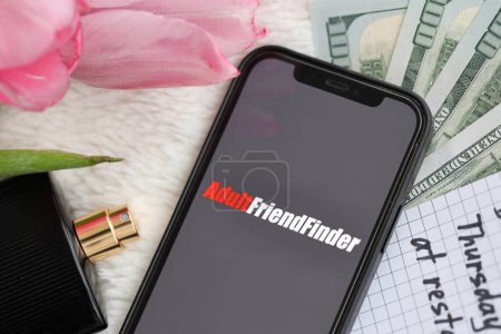 Photo for KYIV, UKRAINE - FEBRUARY 23, 2024 Adult Friend Finder logo of famous dating website or app on iPhone display screen close up - Royalty Free Image