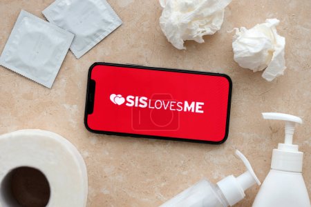 Photo for KYIV, UKRAINE - JANUARY 23, 2024 SisLovesMe adult content website logo on display of iPhone 12 Pro smartphone - Royalty Free Image