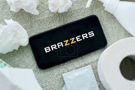 Photo for KYIV, UKRAINE - JANUARY 23, 2024 Brazzers adult content website logo on display of iPhone 12 Pro smartphone - Royalty Free Image