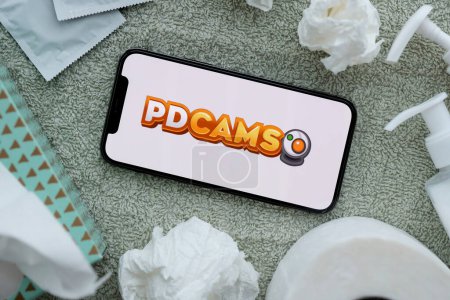 Photo for KYIV, UKRAINE - JANUARY 23, 2024 PDCams adult content website logo on display of iPhone 12 Pro smartphone - Royalty Free Image