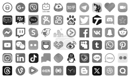 Foto de KYIV, UCRANIA - 1 DE ABRIL DE 2024 Muchos iconos de las redes sociales, mensajeros, plataformas para compartir videos y otros servicios populares y sitios web impresos en papel blanco en color gris - Imagen libre de derechos