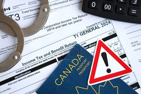 Konzept der Probleme und Probleme bei der Steuerberichterstattung und Steuerzahlung in Kanada. Buchhaltungstabe mit kanadischen Steuerformularen