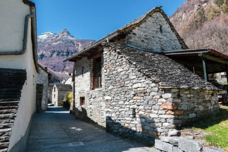 Photo for Sonogno, Switzerland, 10. April 2022: The Historical Village of Sonogno with old Rustico Houses built of Stone in the Ticino, Switzerland - Royalty Free Image