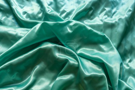 Photo for Satin texture fabric with shiny light green waves as nice background - Royalty Free Image