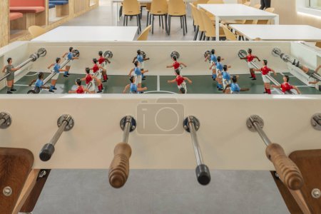 Téléchargez les photos : Espace de loisirs avec baby-foot dans les bureaux de coworking - en image libre de droit