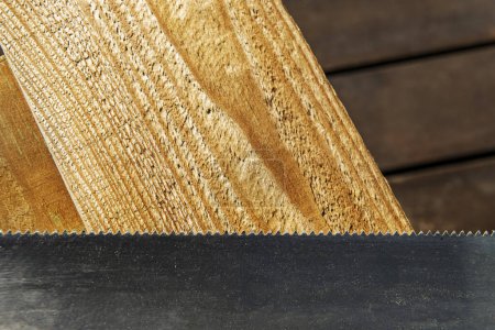 Carpenter's metalic saw teeth on some wooden boards